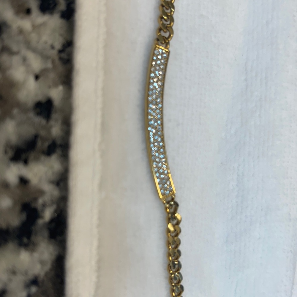 Michael Kors necklace with gold plated chain and parfait stones on bar